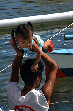 Children Sailing - helping on board the sailboat